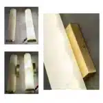 Applique murale cylindrique en marbre et cuivre pour salon détail de montage