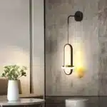 Applique murale noire chic et elliptique dans un cadre moderne