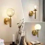 Applique murale dorée avec globe lumineux pour chambre.