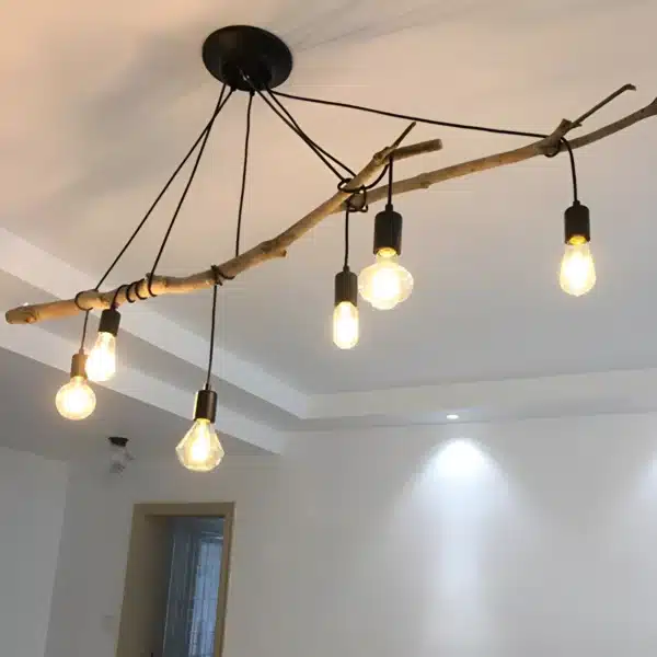 Plafonnier araignée réglable de style loft moderne avec trois câbles suspendus.