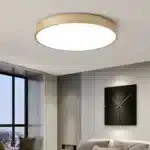 Plafonnier LED minimaliste de couleur brun dans un salon moderne.